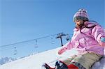 Girl Sliding Downward In Snow