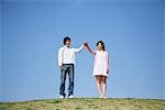 Young adult couple on Grass hill