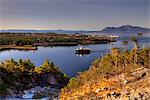 View of Metlakatla, Annette Island, and surrounding coastal area with a ferry in the foreground, Inside Passage, Southeast Alaska, Spring. HDR