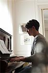 Young man playing piano