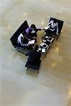 Executives having meeting, high angle view