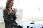 Young woman drinking glass of water