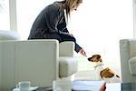 Woman letting dog sniff her hand