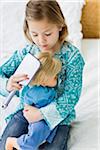 Girl Brushing Doll's Hair