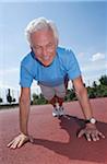 Man Exercising Outdoors on Track