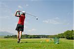 Woman at Driving Range