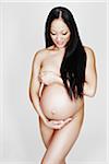 Nude Pregnant Woman in Studio