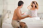 Couple arguing in bedroom