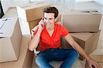 Man talking on cell phone in new home