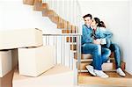 Couple drinking coffee in new home