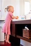 Toddler girl washing her hands