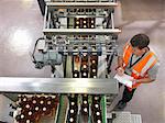 Factory worker in bottling plant