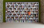 Boy climbing bookshelves