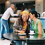 Two women sitting and talking in cafe