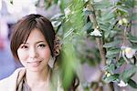 Japanese Women Smiling Near Plants