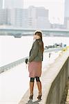 Japanese Women Standing On Wall And Looking Back