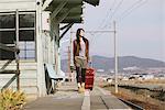 Pretty Stylish Woman At Train Station