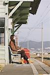 Young Woman Waiting On Platform