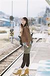 Pretty Young Woman On Platform Looking For Train
