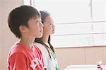 School Friends Sitting Together In Classroom