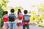 Children With School Bag Walking In Street