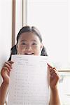 Schoolgirl Showing Her Test Score