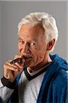 Man Smoking Cigar with Lipstick Kiss on Cheek