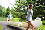 Couple Carrying Canoe, Columbia River Gorge, Oregon, USA