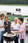 Friends having a barbeque, Sweden.