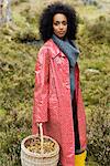 Portrait of a woman wearing a red raincoat, Sweden.