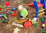 A child playing in a sandpit, Sweden.