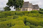 Elaborate topiary surrounding the chateau at Les Jardins de Marqueyssac in Vezac, Dordogne, France, Europe