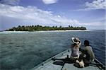 Couple arriving at an island, Maldives, Indian Ocean, Asia