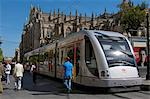 Tram on Constitucion Avenue and Cathedral in the background, Seville, Andalucia, Spain, Europe