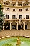 Painted decorated Arch Gallery and fountain of the Plaza del Cabildo, Seville, Andalucia, Spain, Europe&#10;