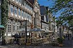 Medieval gables form a background to pavement cafes in Hamelin, Lower Saxony, Germany, Europe