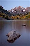 Maroon Bells at dawn with Maroon Lake in the fall, White River National Forest, Colorado, United States of America, North America