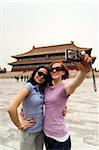 Tourists taking their own photograph in front of the Hall for Worship Of Ancestors, The Forbidden City, Beijing, China, Asia