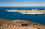 Looking northwest to Caleta del Sebo on Graciosa Island from the Mirador del Rio in the Risco de Famara range in the mountainous north of Lanzarote, Haria, Lanzarote, Canary Islands, Spain, Atlantic, Europe