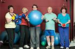 Older people with exercise equipment