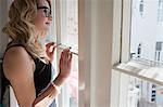 Woman admiring scenery outside window