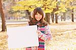 Japanese Women Holding Whiteboard