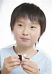 Boy eating sushi roll