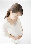 Pregnant woman holding belly