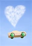 Heart shaped cloud and wooden hot wheels