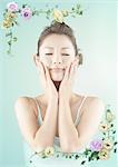 Young woman with hands on cheeks