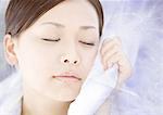Young woman closing eyes