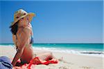 Woman relaxing on Floreat beach, Perth, Western Australia, Australia