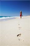 Woman walking on Floreat beach, Perth, Western Australia, Australia