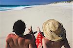 Couple sitting on Floreat beach, Perth, Western Australia, Australia